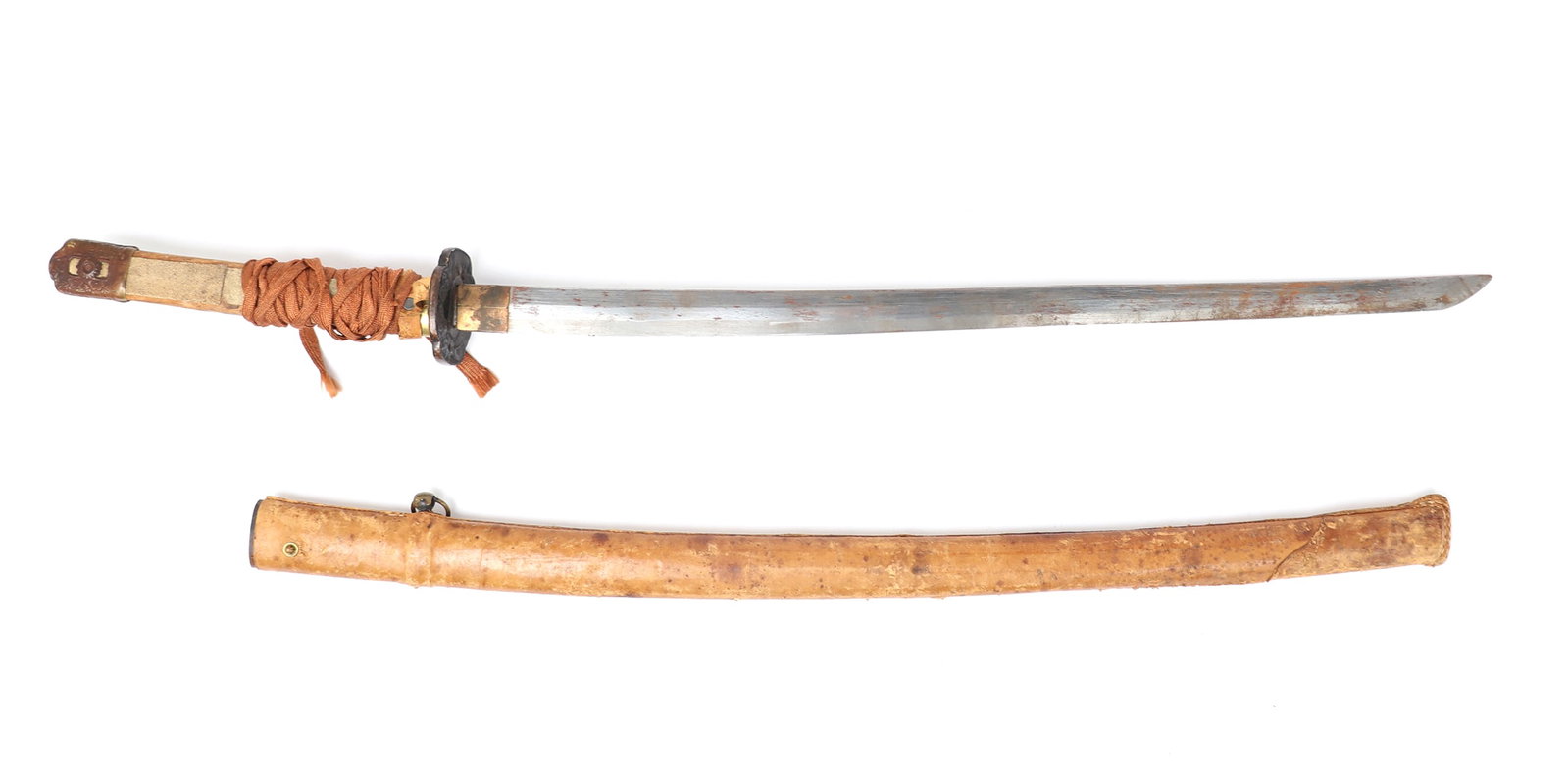 Japanese Katana Sword w/Scabbard, WWII Period: Production Japanese style katana with scabbard produced in the WWII period with a brown leather over the scabbard. Ray skin wrapped grip with brass mounts and a tattered wrapping over grip. Size 39" L