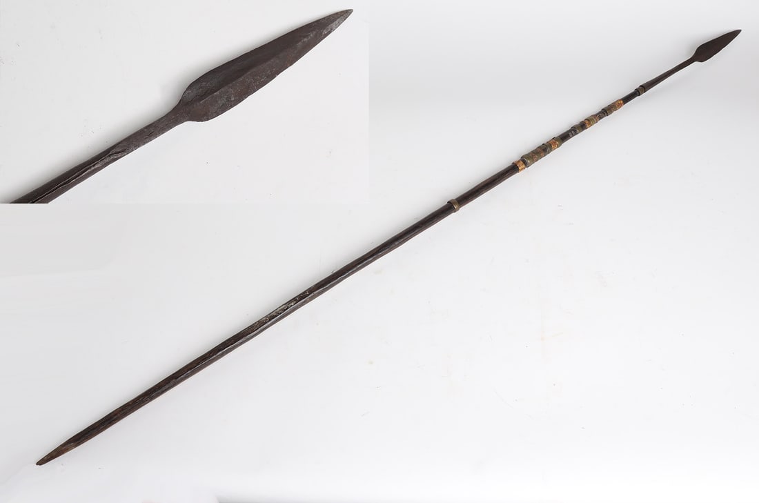 Long Wood Spear w/ Decorated Handle: Long slender wood spear with dark patina wood and decorated handle consisting of decorated brass bands and twine and woven shoots, socketed spear tip of iron and double edged to pointed tip. 63 1/4" L