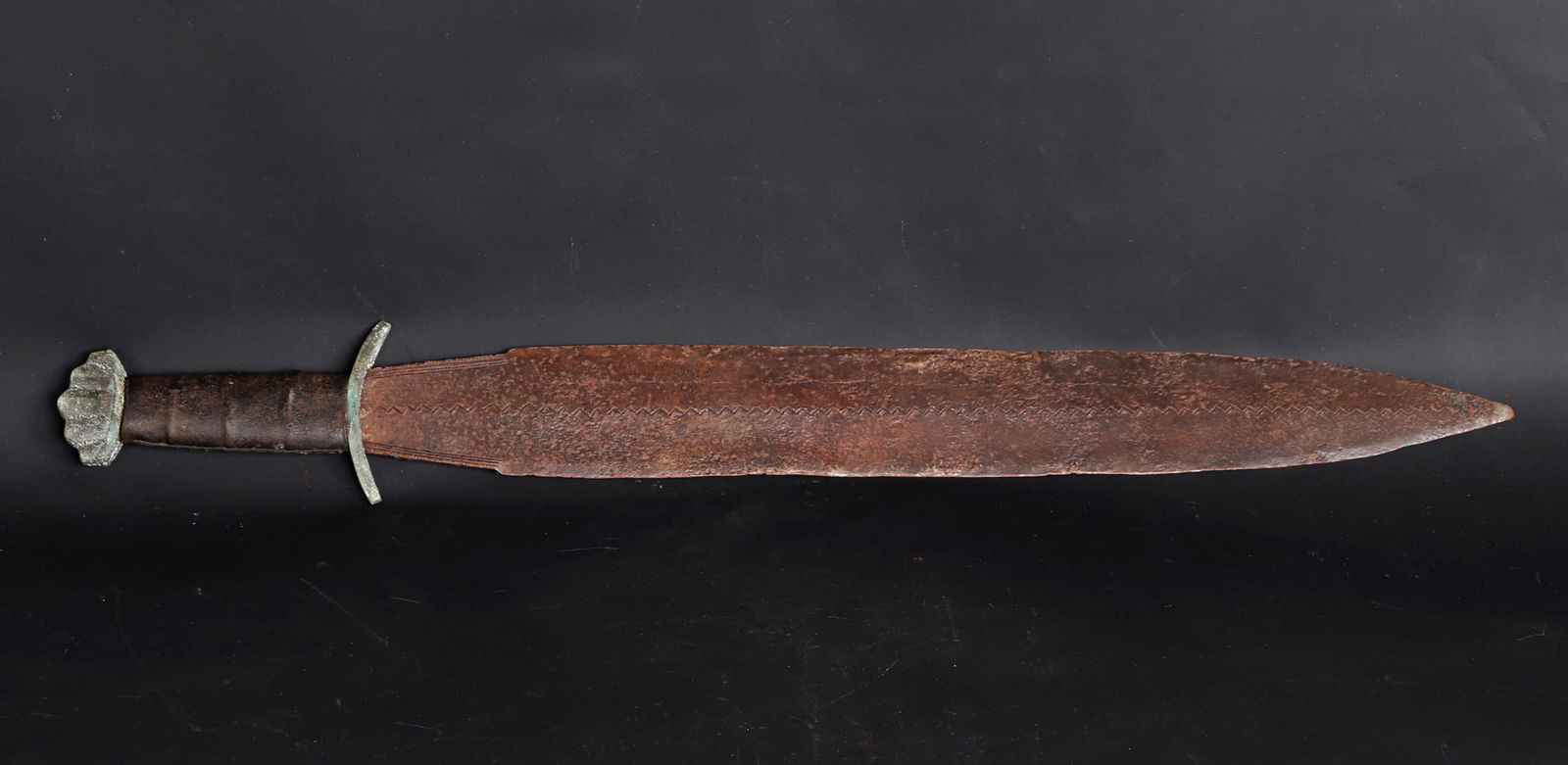 Viking Style Sword: Unusual Viking style sword with type 7 or 9 lobbed pommel, type K downturned cross guard, and a very unusual bulbous blade with zig zag carving down the center. 32"L