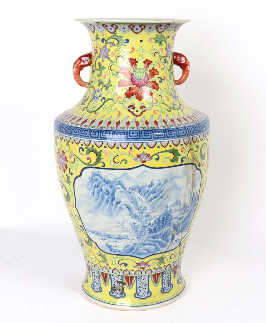 Large Chinese Famille Jaune Vase, Elephant Handles: Lovely detailed yellow ground Chinese porcelain vase, with blue and white landscape scenes to each face. Blooming flowers and wandering vines throughout. Ket fret banding to the shoulder with ruyi ban