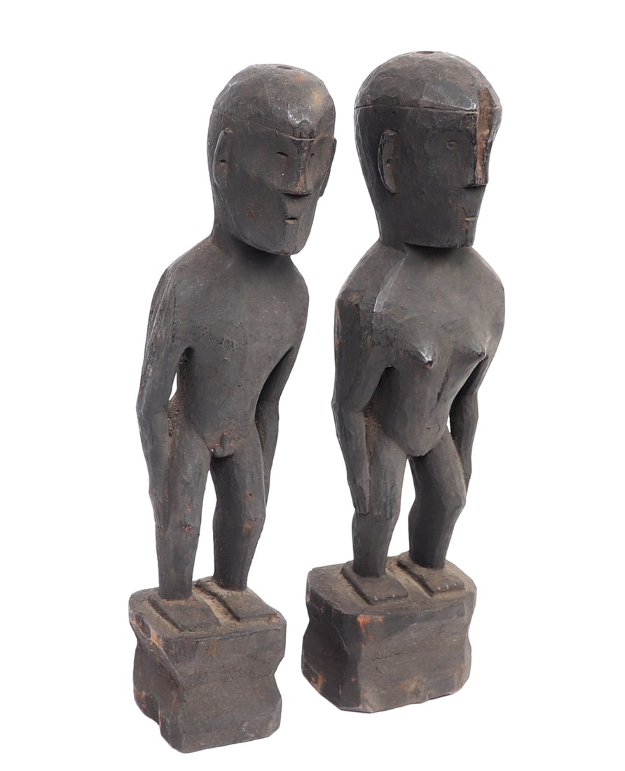 Pair of Male & Female Ifugao Rice Gods, Bulul: Standing male and female Philippines rice god Bulul, each depicted standing naked on a pedestal, with arms at their sides. Small pierced eyes, with chiseled jaw lines, protruding noses and small slit 