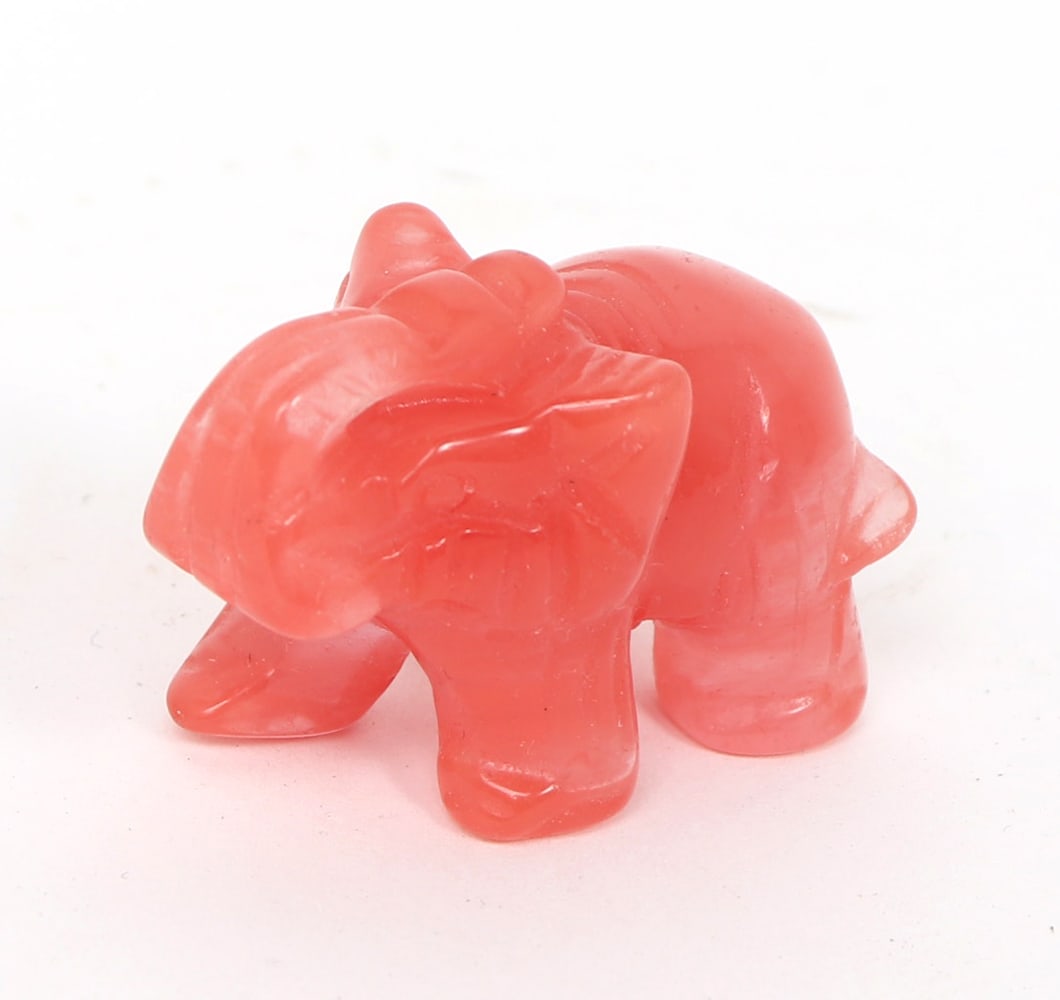 Adorable Miniature Pink Quartz Elephant: Perfectly polished and detailed pink quartz elephant, in a joyful pose with trunk high in the air. Elephants are known for representing power, wisdom and loyalty. This piece would make for a great pen