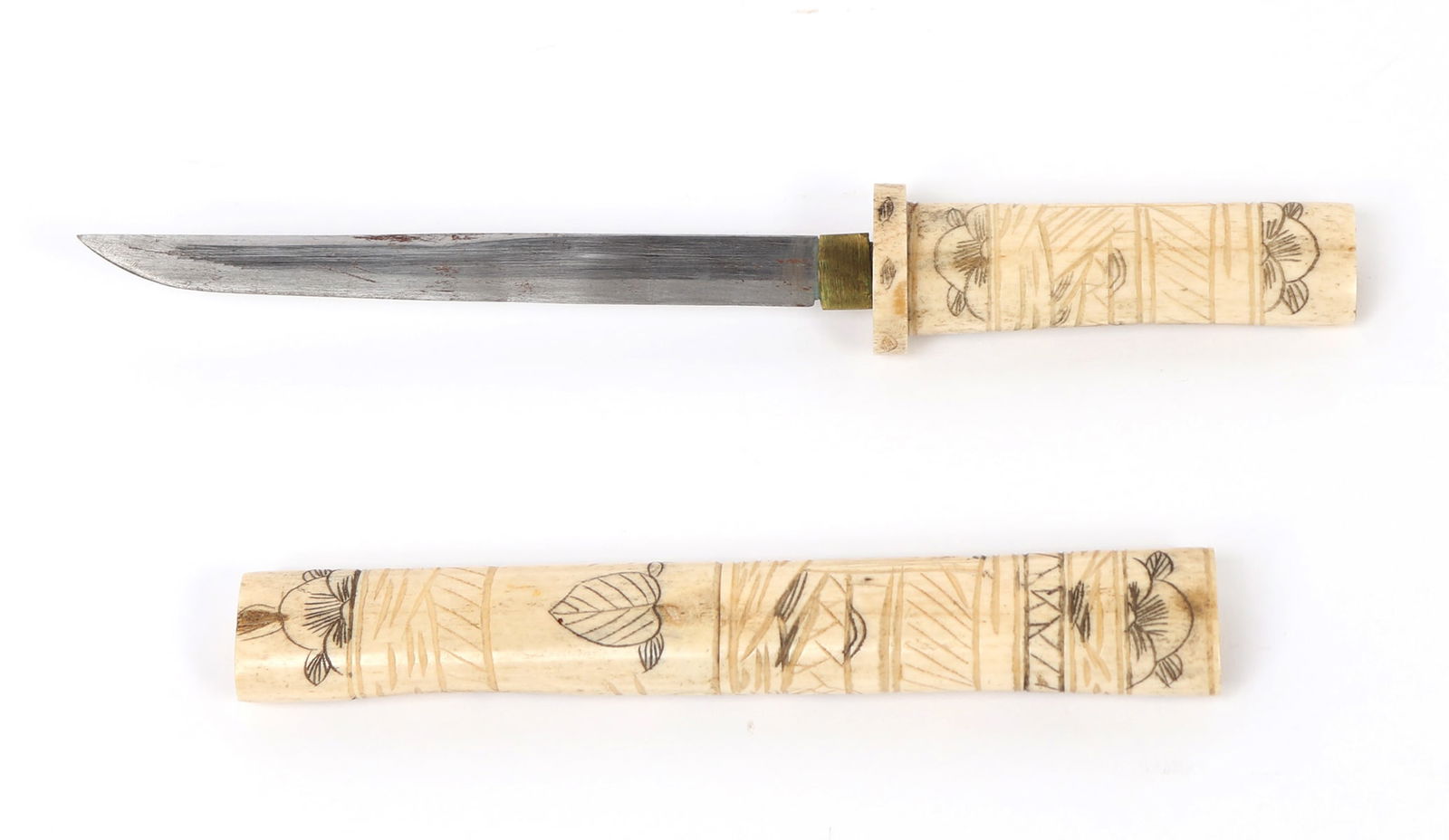 Intricately Carved Japanese Edo Style Bone Dagger: Wonderful example of a Japanese Edo style bone dagger with sheath that is carved from a single piece of bone. Carved in extensive detail with scholars, blooming cherry blossoms, leaf and landscapes th