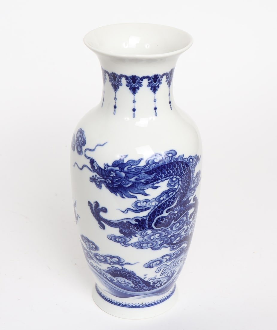 Chinese Blue & White Porcelain Dragon Vase: Chinese blue and white porcelain dragon vase with fluted rim, dragon designs. Two character mark to base. Size 10 1/2" H