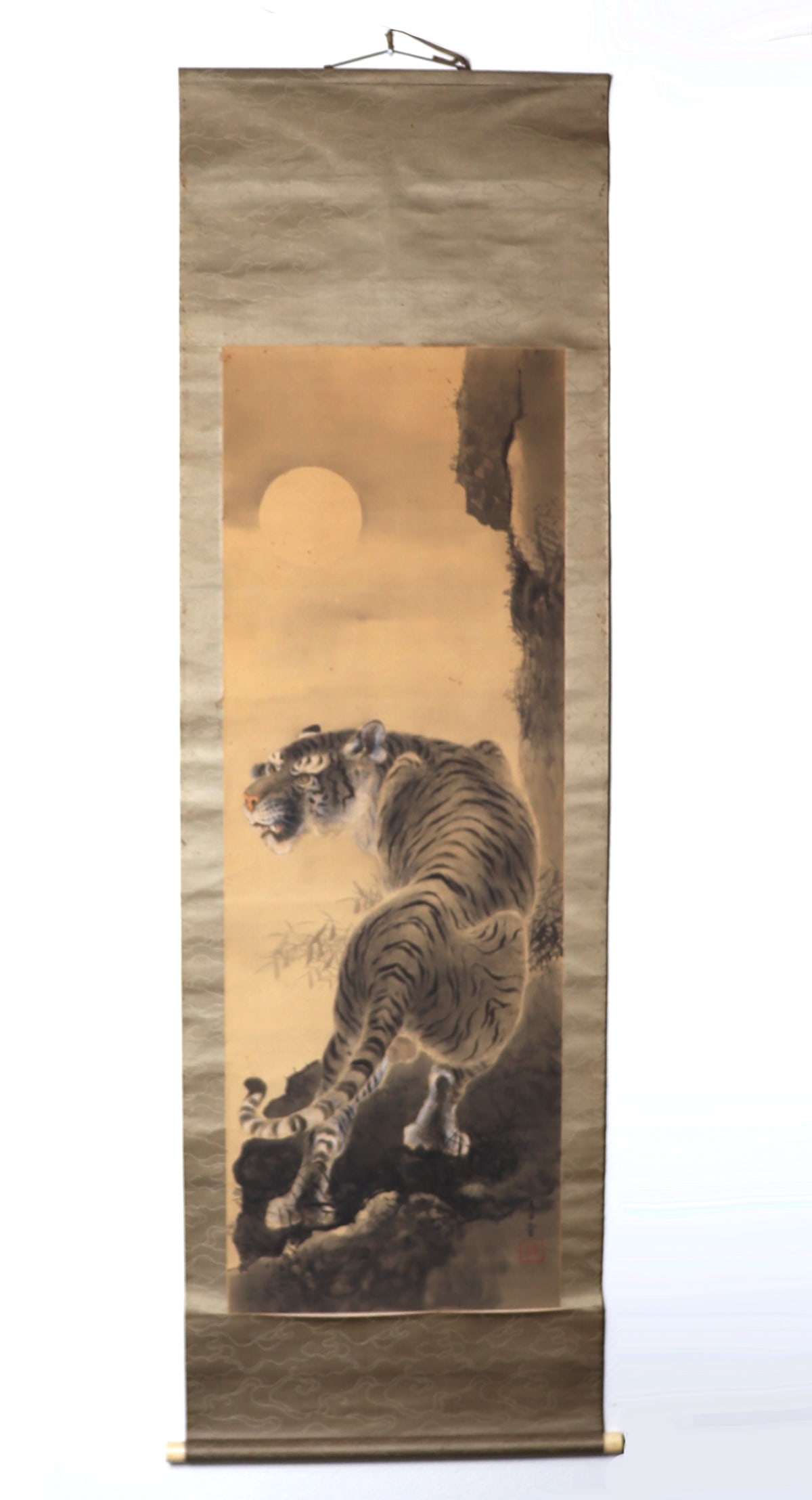 Chinese Painted Silk Scroll, Magnificent Tiger: Finely detailed Chinese painted silk scroll with a beastly tiger on a stroll under a full moon. Prowling around on a cliffside, the ferocious tiger turns his head over his shoulder with teeth showing,