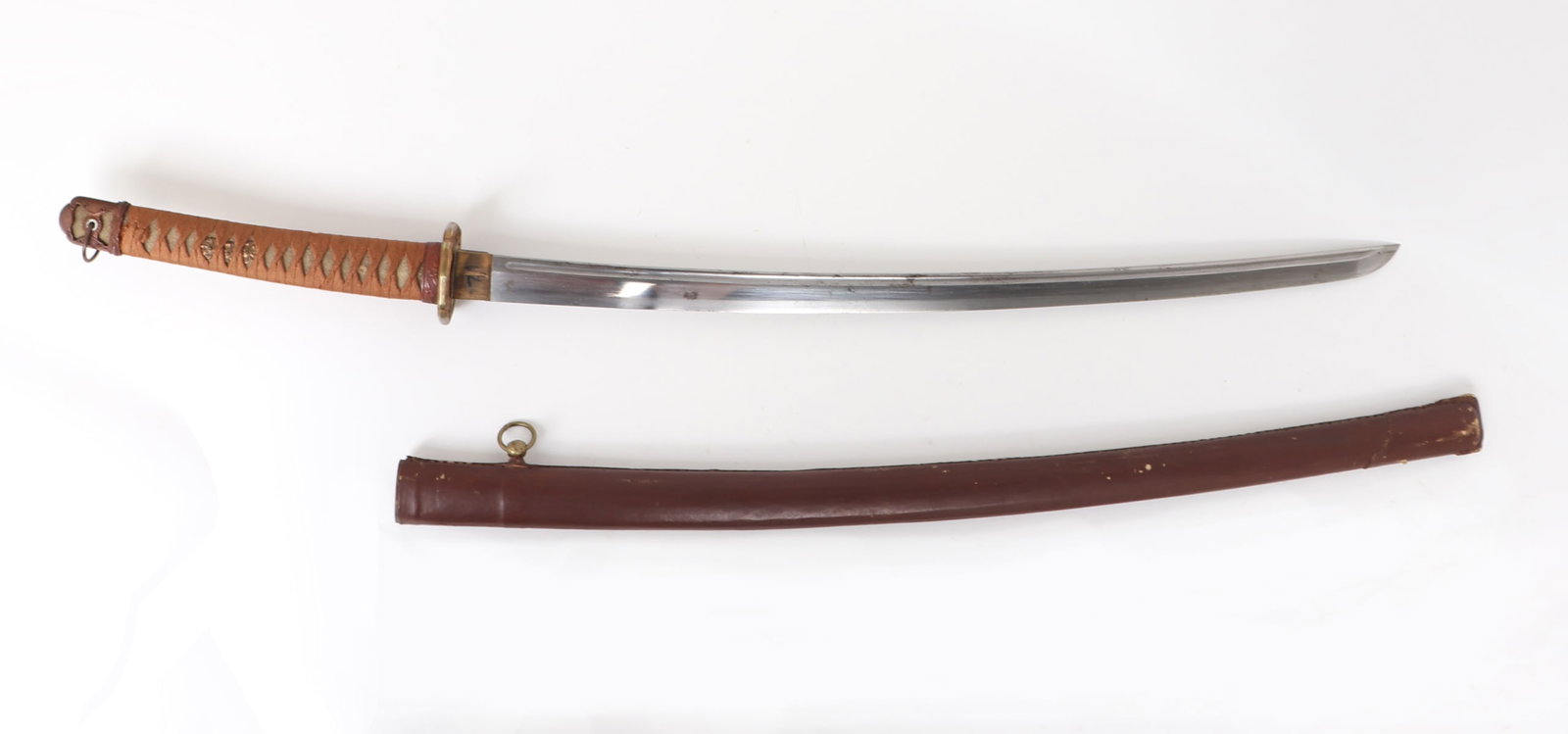 Japanese Katana Sword w/Scabbard, WWII-Era: Japanese sword with scabbard manufactured during WWII. Grip in ray skin with gilt brass mounts including menuki of floral motifs and collar in similar patterns. Thick stippled gilt brass tsuba. Blade 