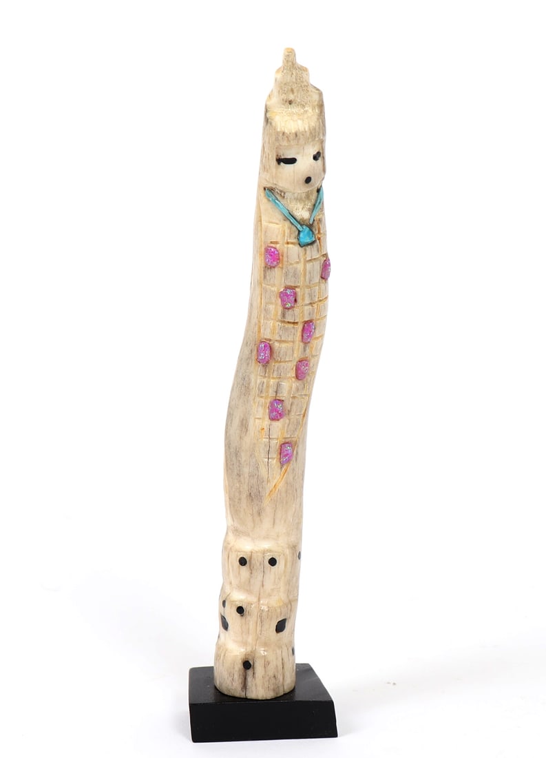 Zuni Antler Carving of Corn Maiden: Wonderfully carved Zuni dear antler, depicting a standing Corn Maiden, with inlays of turquoise, tourmaline and jet. She stands with a headdress and focused expression. Corn hatch marks etched into th