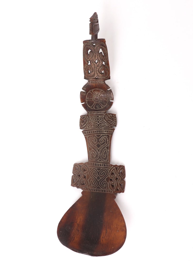 Indonesian Intricately Carved & Incised Spoon: Southeast Asia, Indonesia, Timor Island, late 19th to mid-20th century. Carefully incised and carved from a section of buffalo horn, this spoon represents incredible attention to detail and craftsmans