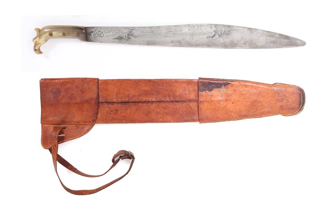 Engraved Mexican Eagle Head Machete Sword w/ Scabbard: Mexican machete sword with wide single edge blade circa 1900-1930. Engraved to the blade in Spanish "Guerreiro Patria Viva Mexico" translated to (Warrior Homeland Long Live Mexico) with foliate engrav