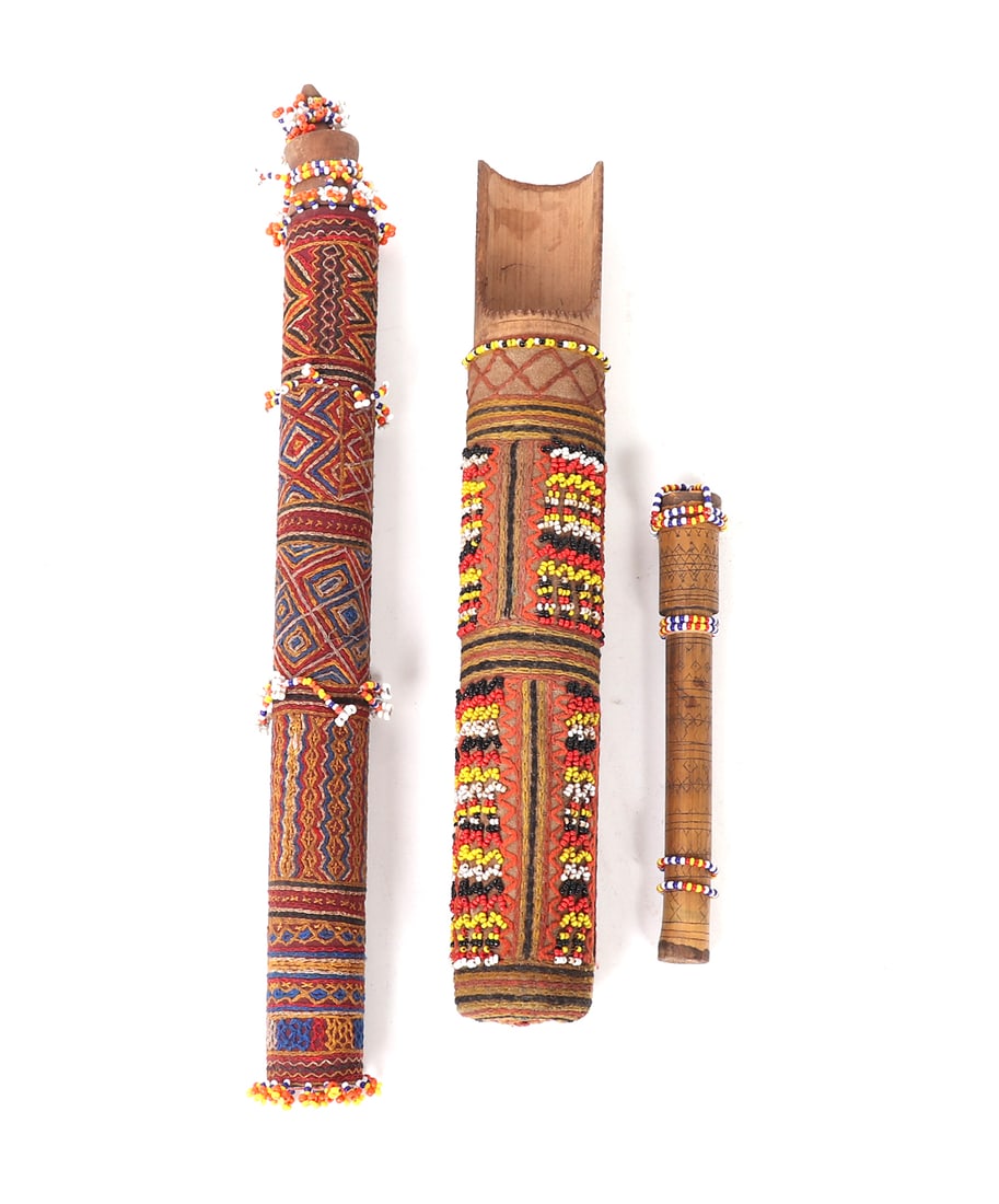Three Filipino Implements: Two bead covered and lidded carrying vessels, with a quiver style carrying case in the middle. Each beautifully detailed with intricate bead work throughout. Size of largest 14" L
