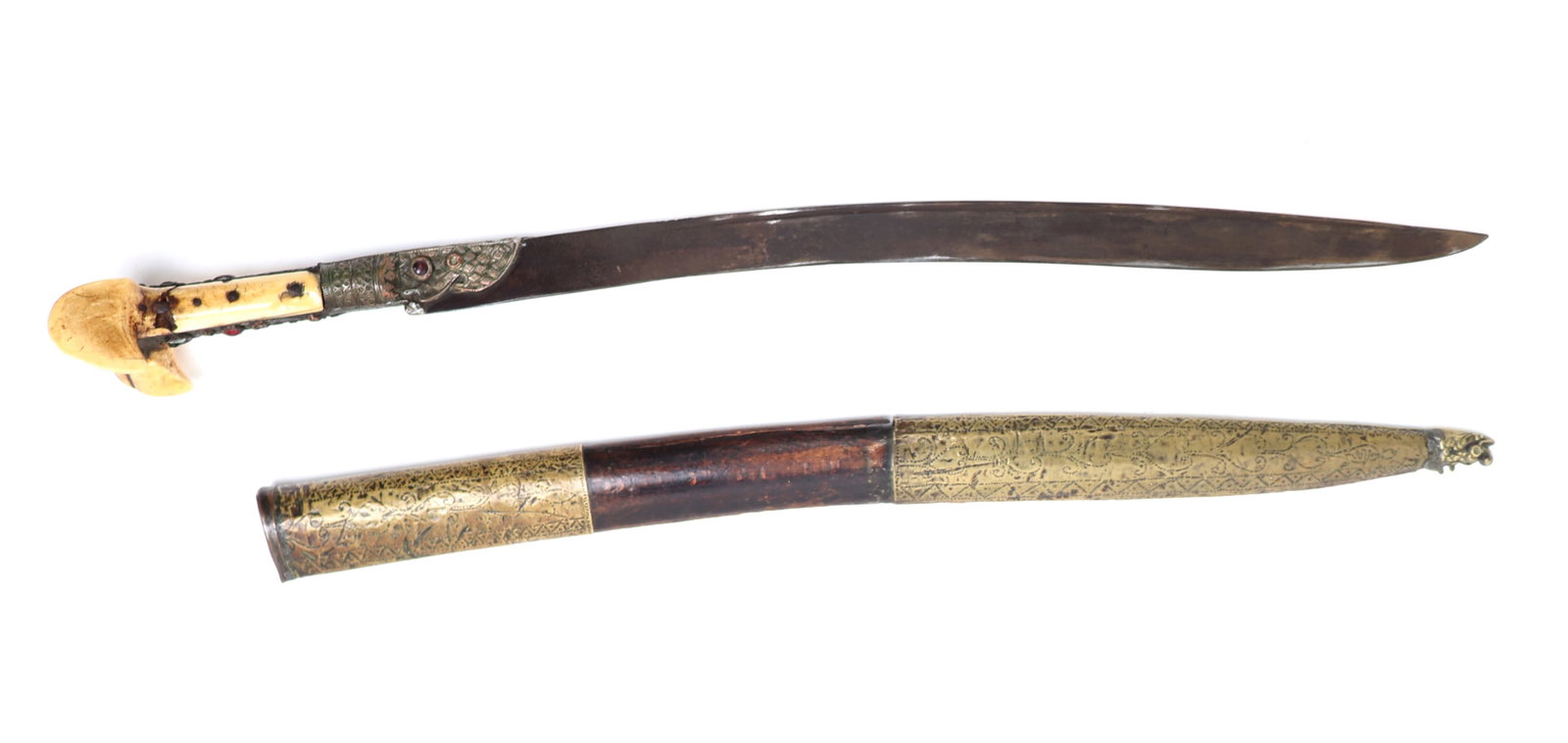 Ottoman Yatagan Sword w/ Scabbard: Ottoman Empire, 19th century or earlier Yatagan sword with scabbard. Lightly recurved single edge blade with a silvered copper ricasso and handle base inset with red and coral cabochons. Handle in bon