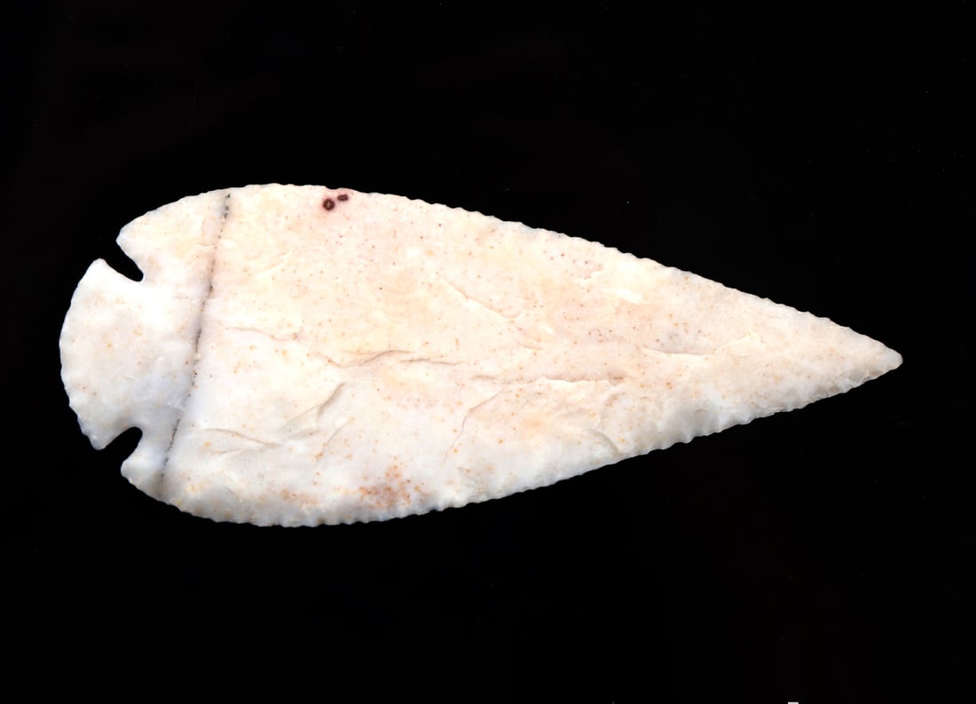 Fine Clifton Agate Projectile Point: Very nice projectile or spearpoint, knapped from Clifton Agate in a teardrop shape with side notch for affixing to the staff or pole. Size 5 3/4" L x 2 1/2" Wex- R. Warren, Springfield Missouri collec