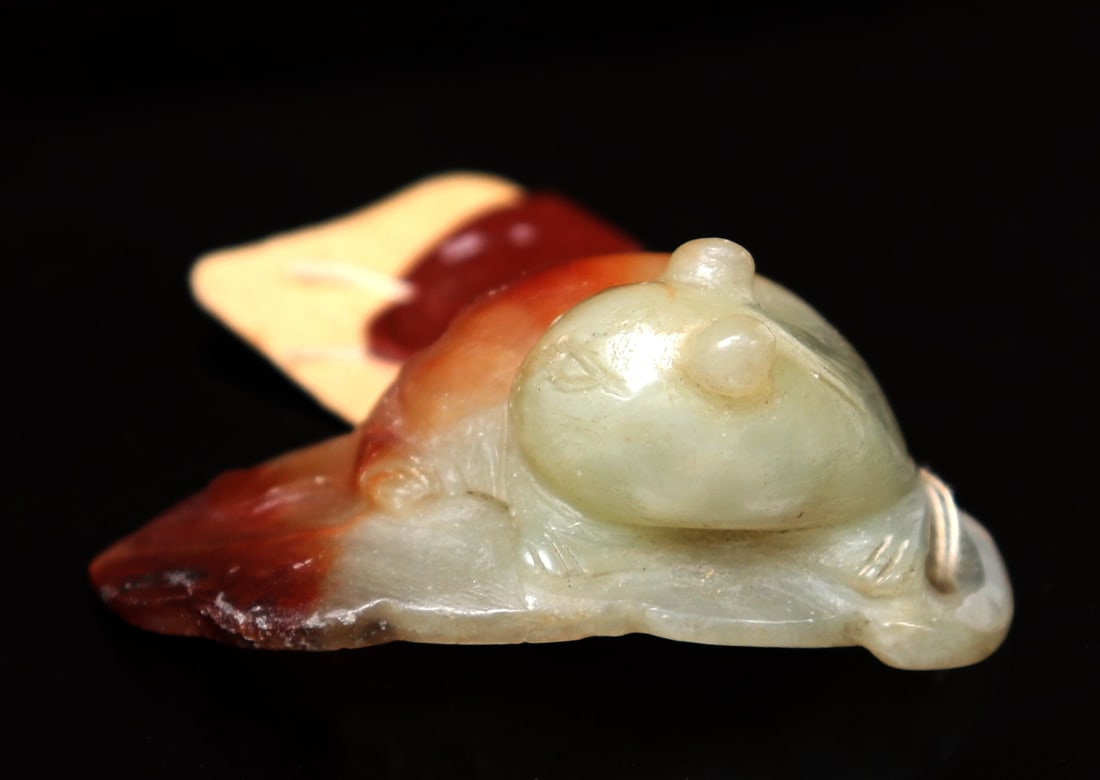 Chinese Jade Feline on Leaf Carving, Qing Dynasty 1644-1912: Chinese jade carving of a feline resting over a large leaf in a beautiful light green and orange color with brown bark colored section around the edge. Including original Hong Kong export certificate