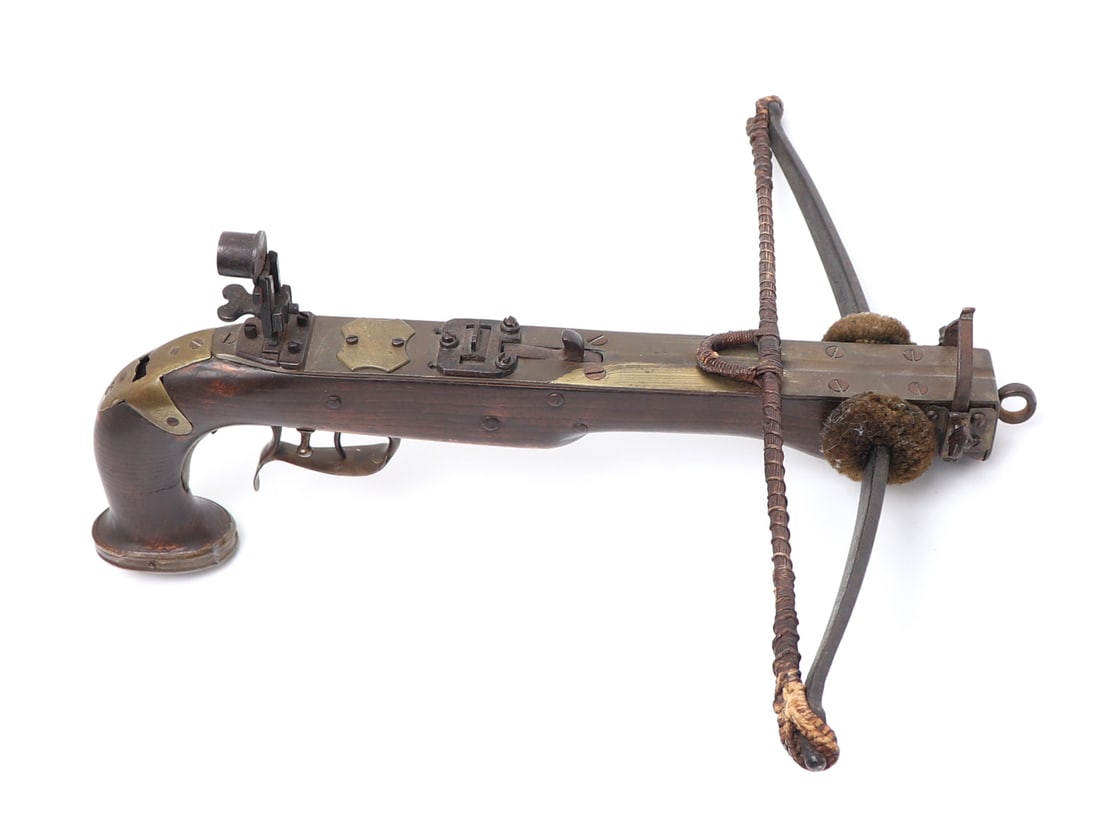 Scarce 'Crossbow' Pistol, Early-Mid 1800s: European, Belgian / French very rare pistol crossbow, circa early to mid 1800s. Wood stock mounted in gilt brass throughout with an expandable stock rear attachment. Iron peep target sight. String wit