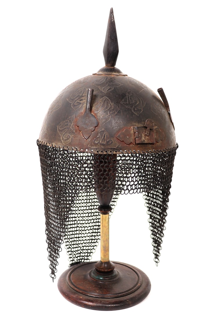 Indo-Persian Khula-Khud Helmet, 19th c.: Persia / India, armour helmet with etched panels of inscription, probably 19th century. Two feather plum holders at either ide of the nasal guard slot which is a hinged design. Chainmail intact with a