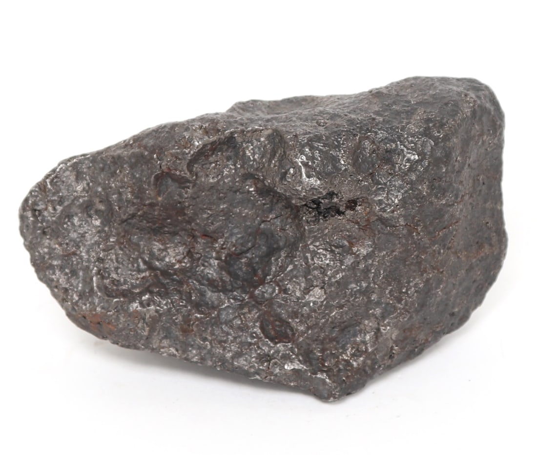 Meteorite Specimen, 1366 grams: Nice size and color meteorite specimen in a dark black iron with well melted surface from re-entry. Size 4 3/4" L x 2 1/2" W, 1366 gramsEx-Pasadena, California collection