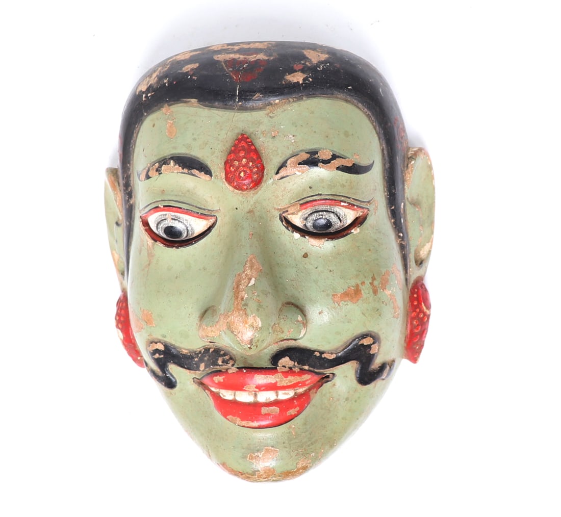 Nicely Painted Balinese Dance Mask: Indonesian wood carved and painted traditional dance mask. Green face with black hair, and red earrings. Wide eyes with narrow slits to the base of the eyes to see out. Size 7 3/4" H x 5 3/4" W
