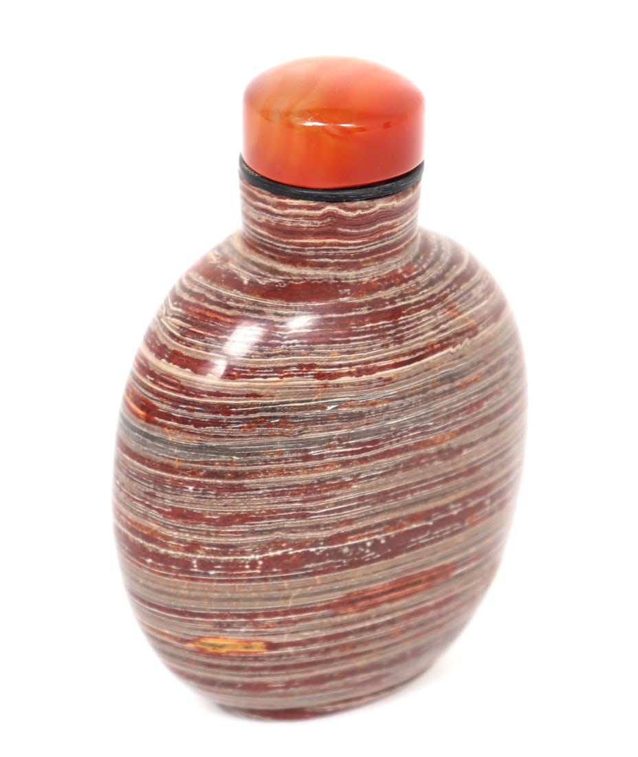Gorgeous Hardstone Carved Snuff Bottle: Marbled hardstone carved snuff bottle with striping throughout. Red coral like stopper with spoon still attached. Size 3" H