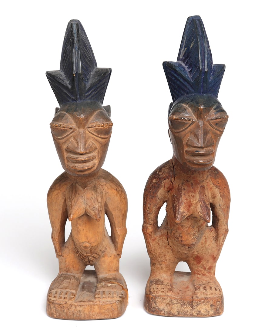 Twin Female Yoruba Wood Carved Ibeji: Lovely twin Ibeji figures, each carved from a single piece of wood and stand on integral base. Standing with arms to their sides standing nude, with almond eyes in high relief, tripart grooved hair co