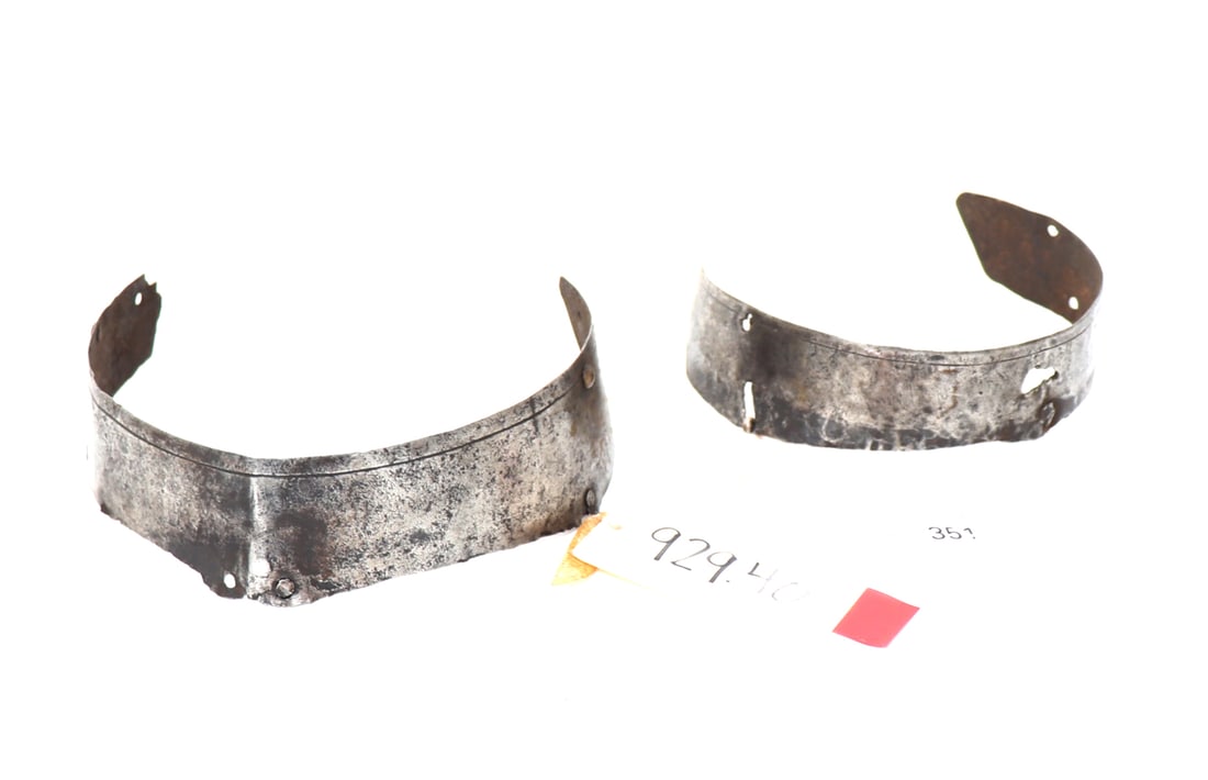 Two European Elements of Armor, 16th - 17th c.: Two medieval elements of armour from a European harness, 16th - 17th century. Left example an arm or gauntlet component, inv# 929.40. Right example an additional gauntlet or arm component with an adju