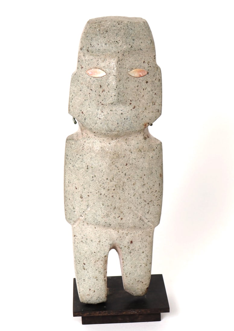 Mezcala Standing Axe God Figure Inset Shell Eyes: Pre-Columbian, Mezcala style stone standing axe god figure with almond shaped shell inset eyes. Light green hardstone with typical wear to the feet and edges mount on custom bronze stand color matched