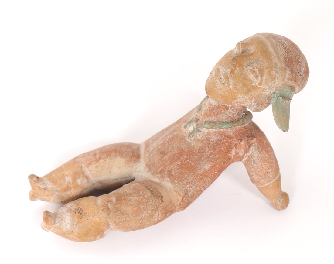 Jamacoaque Manabi Polychrome Reclining Man: Ecuador, circa 500 AD, Jamacoaque polychrome figure in a relaxed, reclining position. Arms propped up behind him, the figure appears to be gazing upwards possibly at the night sky, or to the trees abo