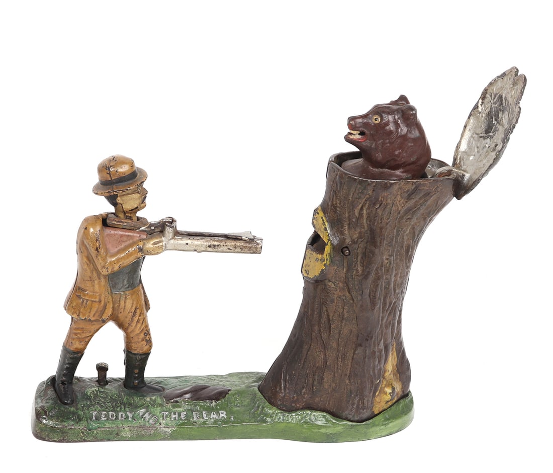 Teddy and the Bear Mechanical Bank: Excellent functioning condition and original Teddy and the Bear mechanical bank circa 1906. Teddy famously participated in the big game hunt and after no bears were found one was tired to a tree and T