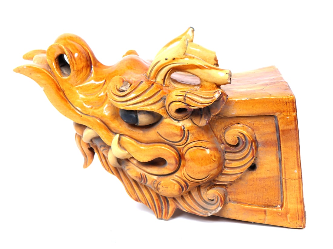 Antique Korean Dragon Roof Finial: Antique Korean glazed dragon roof finial. The finial displays curled sharp teeth, horns, flaired noes and piercing black eyes with wave-like long flowing wispy strands stylistic features intended to r