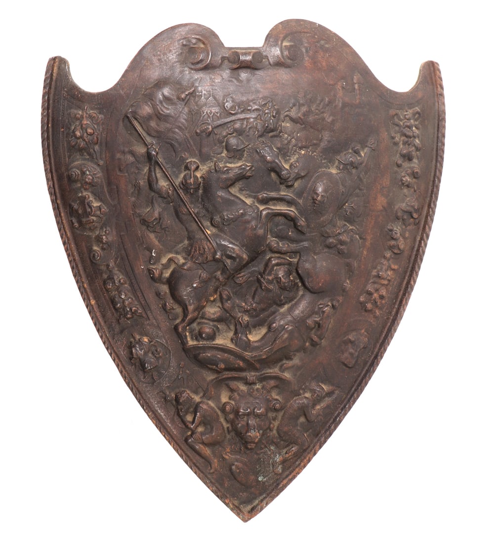 Heavy Renaissance Iron Shield: Very heavy and well cast iron shield with an intricate battle scene of a mounted warrior slaying another fallen rider. The background surrounded by additional images of battle and renaissance motifs.