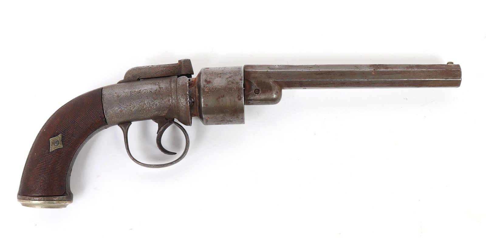 Engraved English Transitional Revolver, Circa 1840 - 1850: Early English transitional percussion revolver with dark brown walnut grips. Engraved all over with light scrolling patterns and decoration. Octagonal barrel stuck with two proof marks under the barre