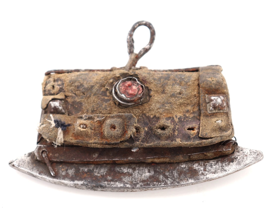 Antique Tibetan Flint Stater: Very old Tibetan flint starter with a leather flap and stone inset center piece. Probably yak leather with iron mounts. Size 4 1/2" W x 3 1/4" HEx-Southwest Arms and Armour Collection