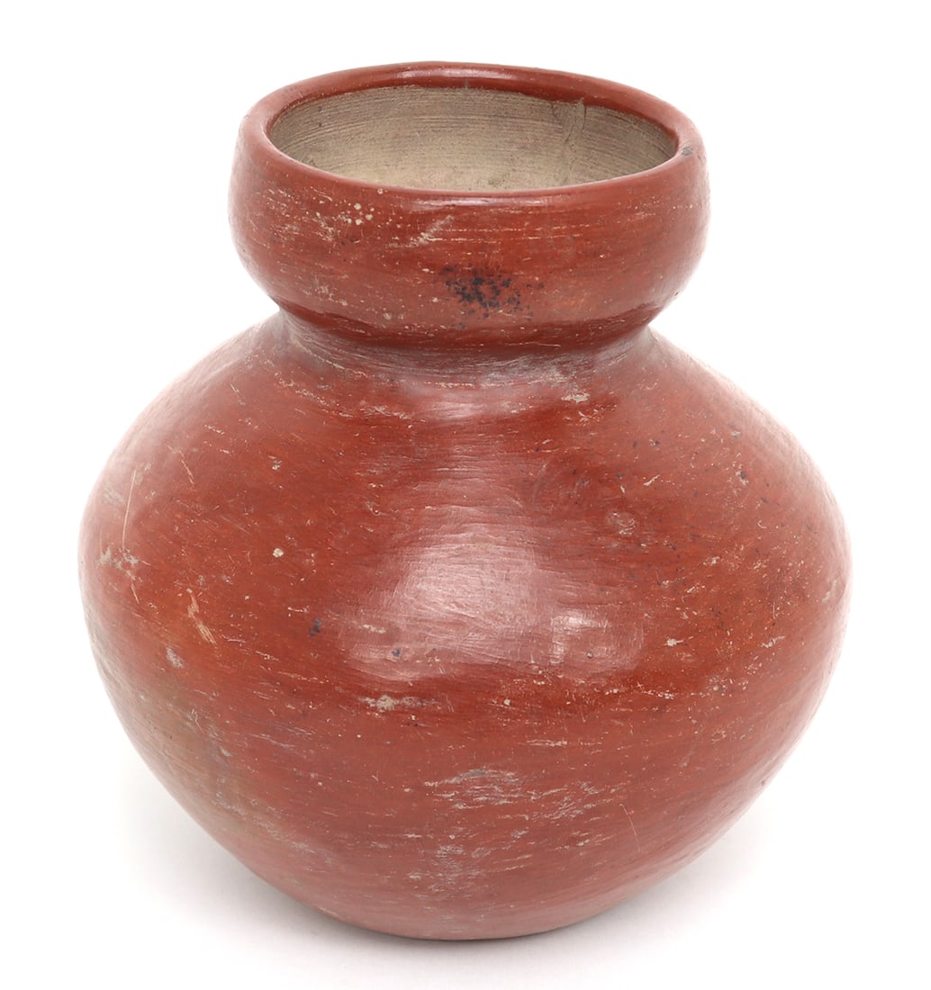 Pre-Columbian Terracotta Redware Water Vessel: Pre-Columbian, West Mexico, Colima 300BCE - 300CE. Authentic vibrant red slip water vessel with bulbous body, tapered neck, and flared opening. Manganese deposits reactive with testing. Size 5 1/2" H