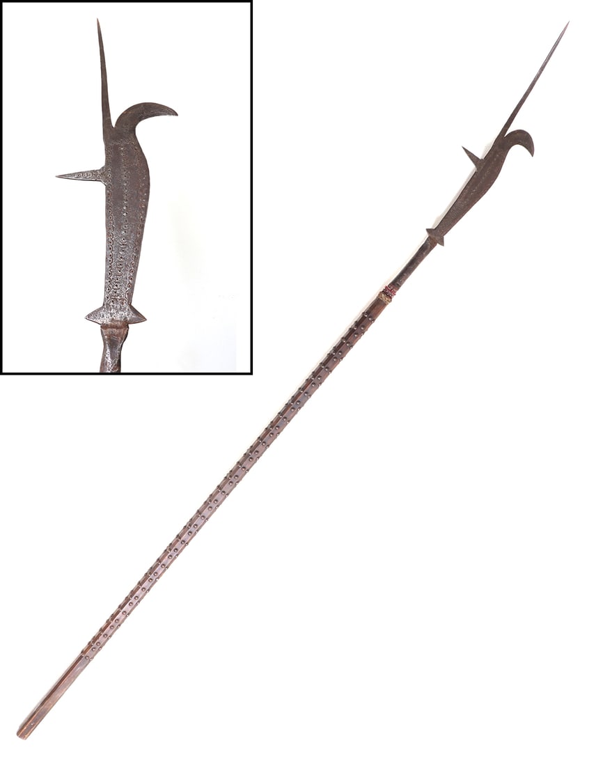 Italian Bill Polearm, Ex-John Woodman Higgins Museum: Substantial Italian Bill polearm with a large hook to one side, two lower horizontal spikes, one reverse spike, and one tall slender spike. Surface of the blade profusely covered with deeply stippled