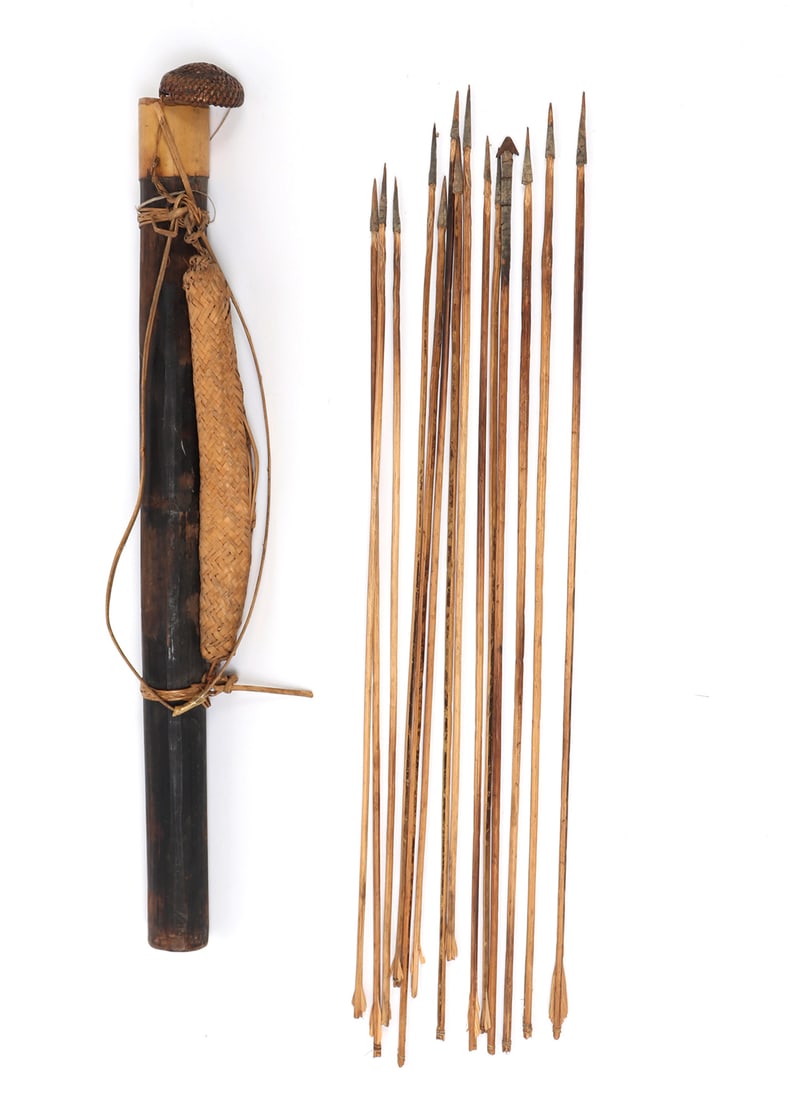 Bamboo Quiver with Rattan Pouch, Thirteen Arrows: Dark brown patinated bamboo quiver with rattan pouch. Thirteen arrows with sharp points and guiding feathers. Quiver includes a finely weaved rattan and bamboo lid and bamboo carrying strap. Size 26 1