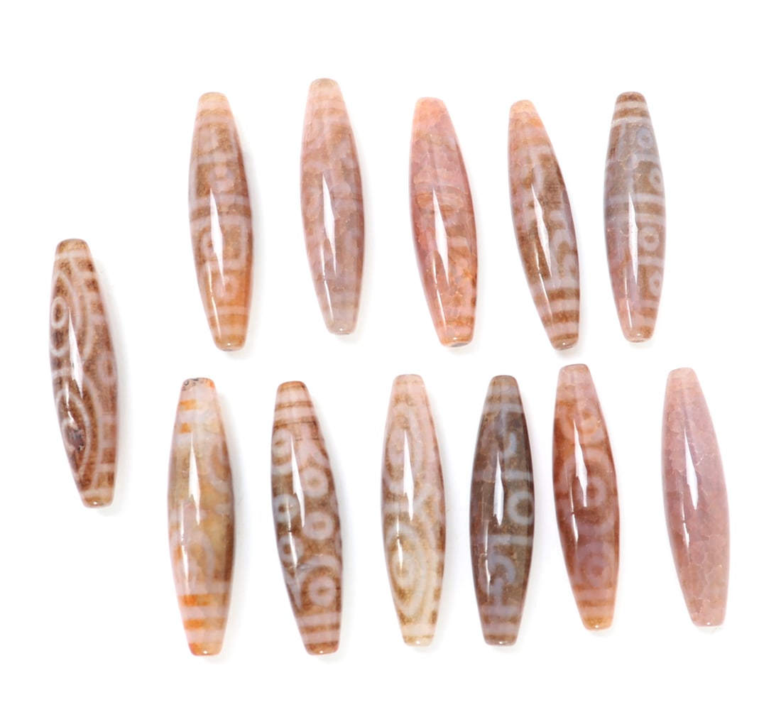 Wonderful Group of 12 Agate Tibetan Dzi beads: Gorgeous set of polished crystal pink and brown agate Dzi beads. All varying in color from light pink to a lovely chocolate brown. All include wonderful crystal inclusions throughout. Size 2 3/8", 200