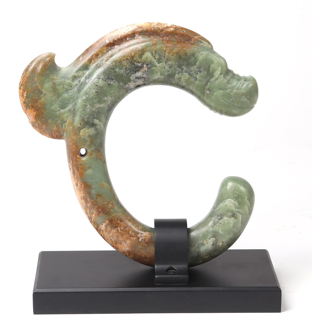 Very Fine Chinese Jade Pig Dragon: Gorgeous Chinese carved mottled green jade pig dragon. The circular beast with large fin emerging from its back, long snout and upturned nose and an almost grin-like expression. Biconically drilled fo