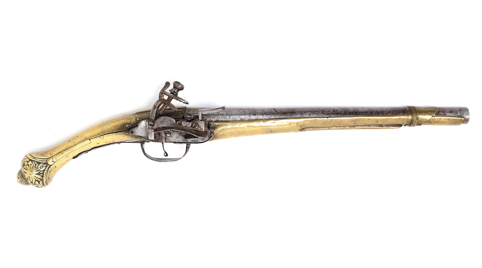 Rattail Flintlock Pistol, 18th-19th c.: 18th to 19th century bright polished gilt brass stock pistol in all steel with floral motifs to the butt of the stock. Miquelet flintlock firing mechanism. Round smooth bore barrel with remnants of gi