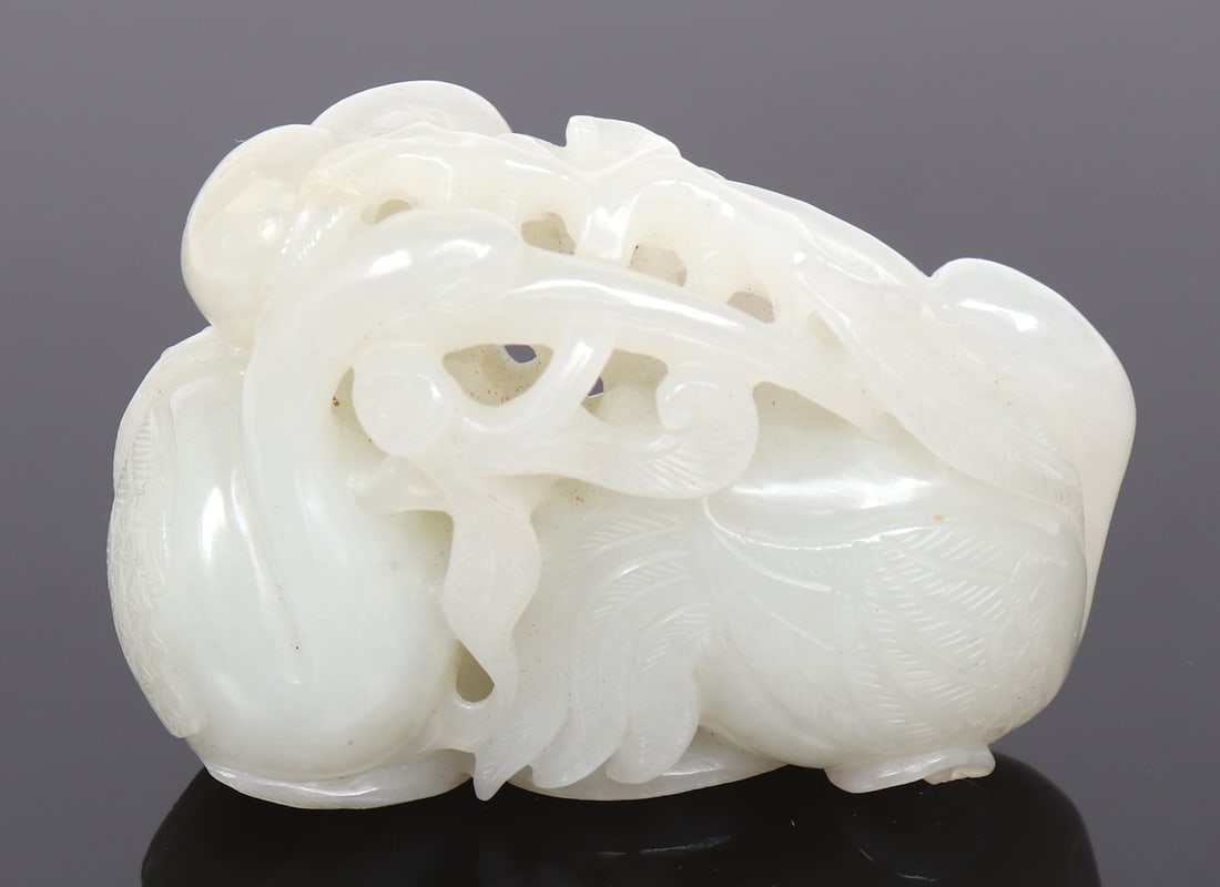 Chinese Pierced & Carved White Jade Crane, Qing Dynasty 1644-1912 CE: Chinese, Qing Dynasty 1644-1912 CE. Exquisite Chinese intricate openwork carved white or hetian jade toggle of an avian / crane. The crane in a resting position with head turned back towards foliage s