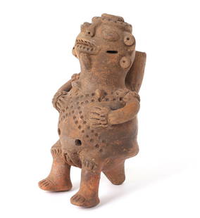 Costa Rican Pottery Female Whistle Ocarina: Cabonera, Osa Peninsula Period IV Ca. Well modeled and expressive seated female ocarina with large eyes. Hollow for the purpose of being a whistle, she sits with her hands resting on her hips, incised
