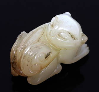 Adorable Chinese White Jade Cub Carving: Miniature white jade or possible mutton fat jade carving of a jaguar cub. Depicted in a low crouched position with head turned towards the notion of danger. Incised fur details as well as almond slit