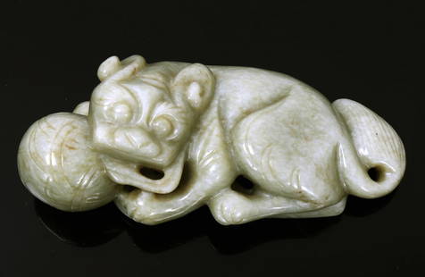 Chinese Green Jade Foo Dog and Ball Pendant: Very nice Chinese green jade foo dog and ball carved pendant, his tail acting as the suspension loop. Foo lion has his mouth agape almost like he's trying to play with the ball. Incised details