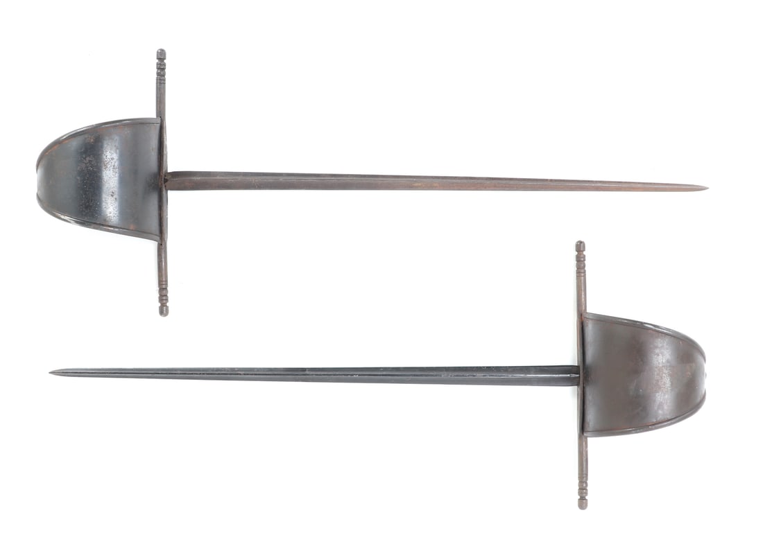 Pair of Left Hand Daggers, 18th C. style: Pair of European left hand daggers or parrying daggers known as Main Gauche with sail guards. 18th century style. Each with matching triangular form blade and straight quillion. The main gauche is a p