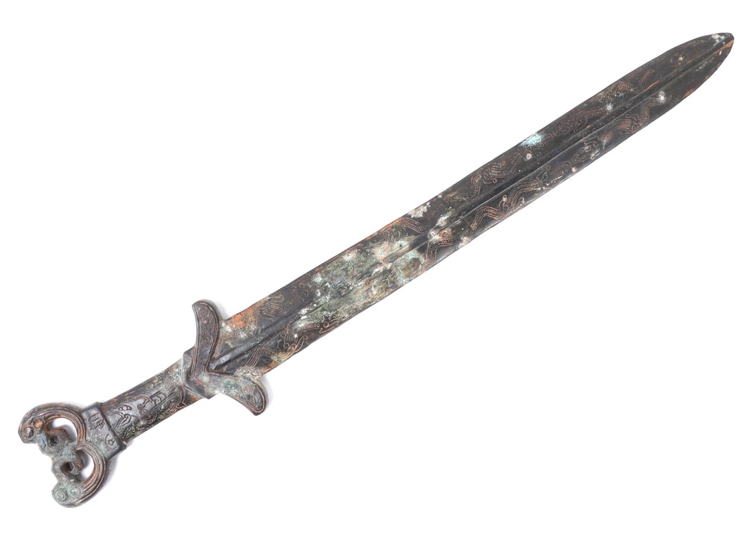 Chinese Archaistic Style Stone Sword: Vintage Chinese silk cased hardstone sword in the archaistic style with inscriptions and engraving. Carved in one piece with scrolling motifs and an openwork pommel. Size 26 1/8" L, Blade 20" L, Box 2