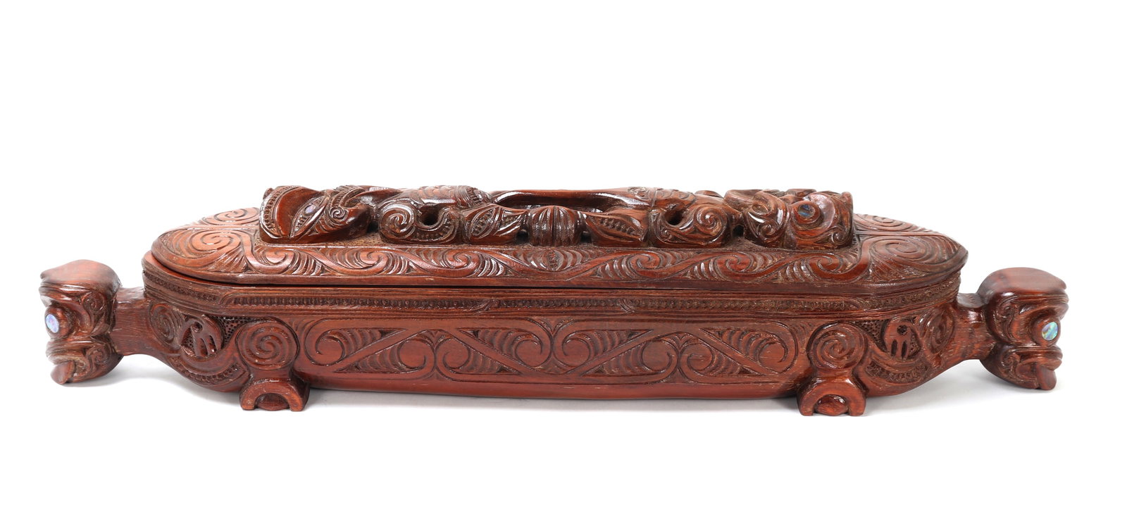 Vintage 1977 Hand Carved Maori Feather Box: Hand carved and signed on the base by Jony Kapua, Rotorua, N.Z., dated 1977. Beautiful hand carved wood Wakahuia feather box, also called a feast box. Typically used for storing Huia feathers which we
