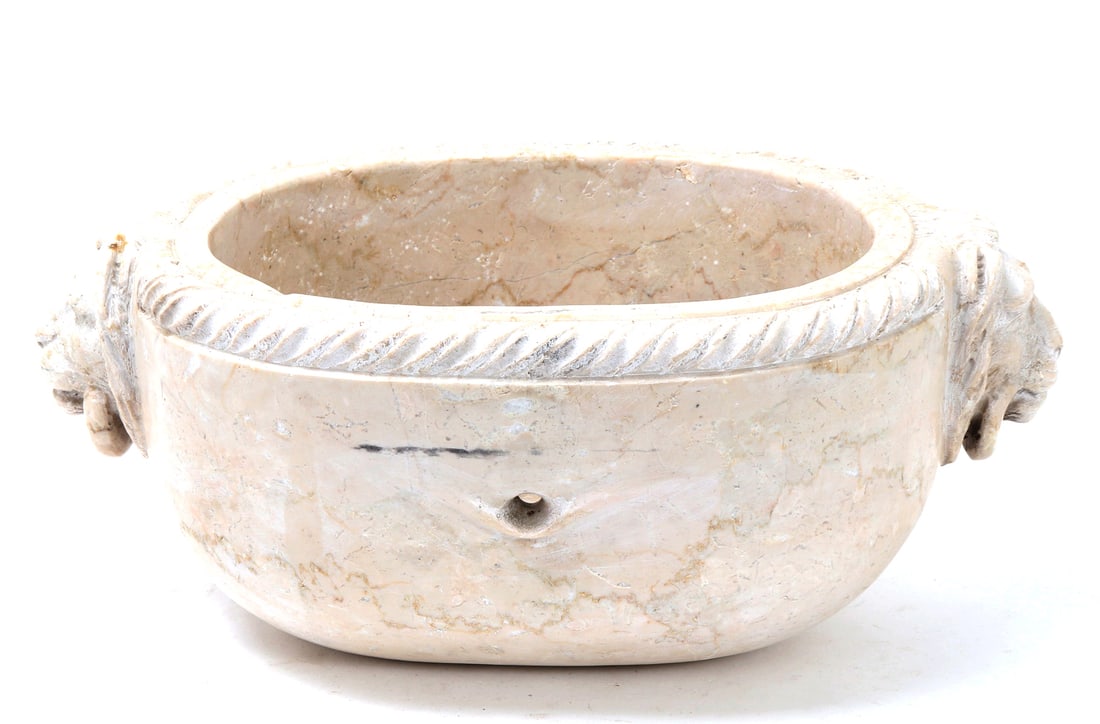 Grand Tour Italian Marble Bathtub: Italian Grand Tour style carved marble bathtub with lions heads at either end and loops handing from their jaws. The interior is deeply carved with a single pierced opening to one side. Size 15 3/4" L