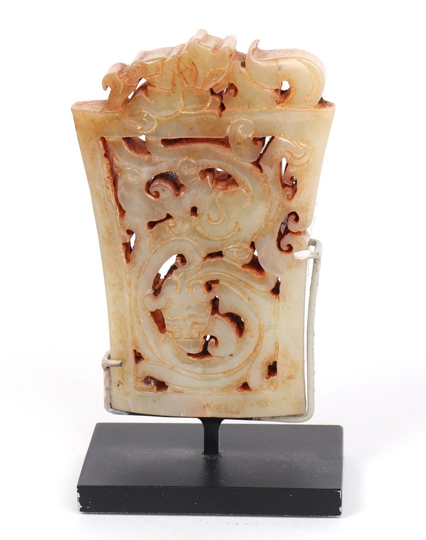 Exceptional White Jade Openwork Sword Scabbard Chape, Han Dynasty 206 BCE-220 CE: China, Han Dynasty probably Western Han 206 BCE-220 CE. Exceptional and semi-translucent jade 'scabbard chape' carved in openwork dragon motif from an exception stone of thick white jade. Dragon heavi