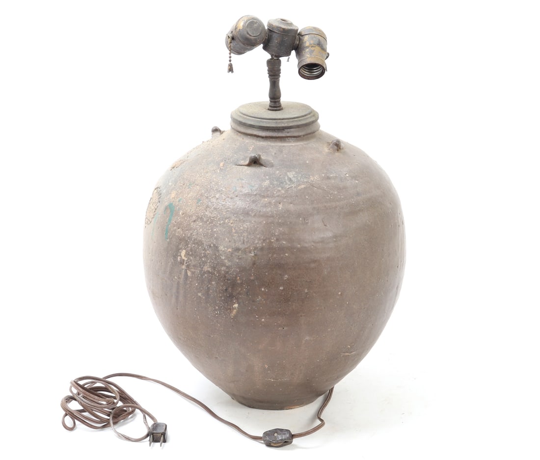 Massive Chinese Terra-Cotta Trade Vessel Lamp, Ming Dynasty: Large Chinese dark brown glazed terracotta pottery jar, Ming Dynasty 1368-1644. Popular for storage and export within Southeast Asia, Japan, and the Middle East these large vessels would have containe