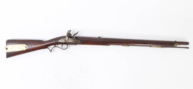 British Flintlock Baker Rifle, Circa 1800-1810: Rare example of a British military pattern 1800/1810 Baker flintlock infantry rifle, dating from approximately 1800 to 1815. This .70 caliber rifle features a 30.25" rifled browned twist-iron barrel w