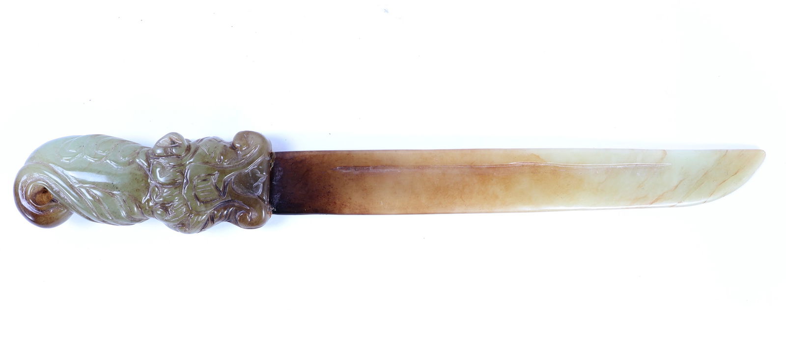 Handsome Chinese Jade Carved Dagger: Hand carved Chinese jade ceremonial dagger with a dragon motif in intricate details as the handle. Marbled green and white coloring throughout with some translucency to the tip of the dagger. Size 11