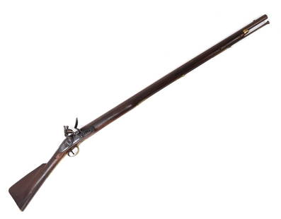 British East India 3rd Model Brown Bess Flintlock Musket, 1806: Antique British Military 3rd Model known as the India attern brown bess flintlock service musket, circa. 1790-1810. Round steel barrel is approximately 38.75" long with a .75 caliber. Marked to the ba
